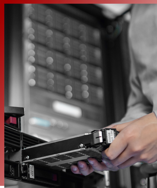 Man with badge in server room checking
