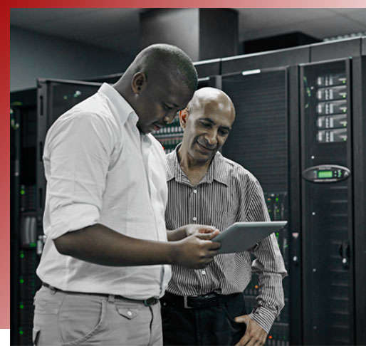 Man with badge in server room checking