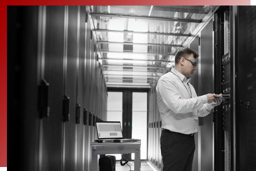 Man with badge in server room checking